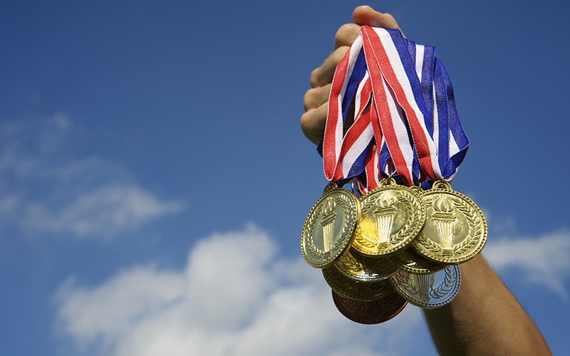 Gold medal with blue sky background